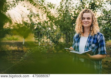 Culry-haired Woman With Vegetables Growth Checklist, Agro Business Development And Portrait. Farming