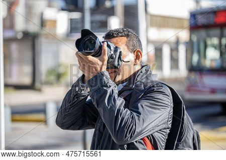 Close-up Of A Photographer Taking A Picture.