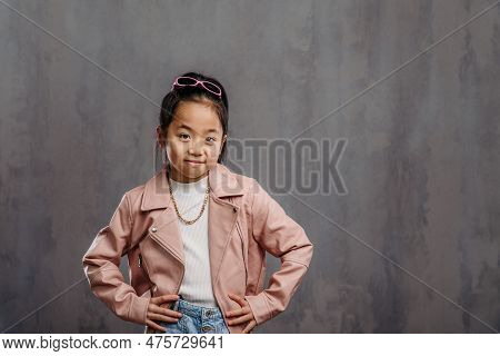 Portrait Of Little Japanesse Girl With Leather Jacket.