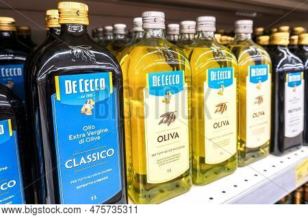 Samara, Russia - April 30, 2023: De Cecco Olive Oil In Bottles On The Shelf In A Superstore. Various