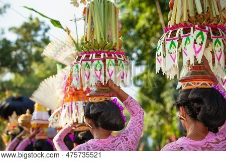 Procession Of Beautiful Balinese Women In Traditional Costumes - Sarong, Carry Offering On Heads For