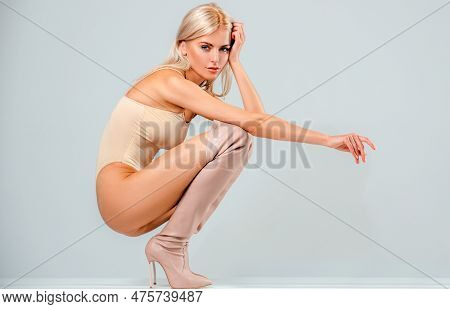 Beautiful Fashionable Woman In High Heel Boots Posing In Studio. Outfit Detail Of Fashion Stylish Wo