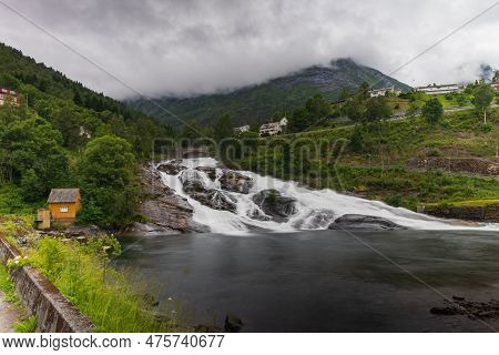 Hellesylt, Norway - July 2019: Hellesyltfossen Is One Of Many Norwegian Waterfalls In The Area Geira