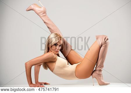 Fashion Female High Heel Boots. Fashionable Woman In High Heel Boots Posing In Studio. Sexy Woman We
