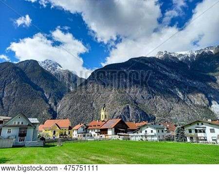 Clouds Over Zams And The Alps Mountains