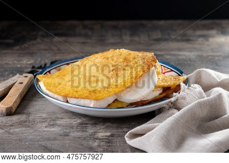 Traditional Venezuelan Beef Cachapa On Wooden Table