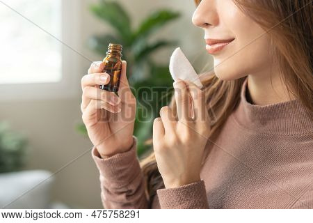 Aromatherapy, Asian Young Woman Hand Holding Cotton Pad, Bottle Of Essential Perfume Oil, Enjoying S