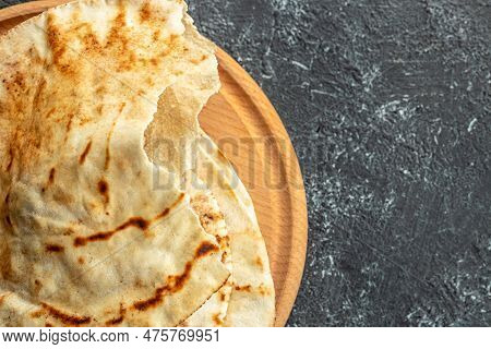 Pita Arab Bread. Flatbreads. Food Recipe Background. Close Up.