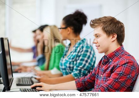 education concept - student with computer studying at school