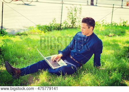 Businessman Traveling, Working In New York. Wearing Blue Collarless Shirt, A College Student Sitting