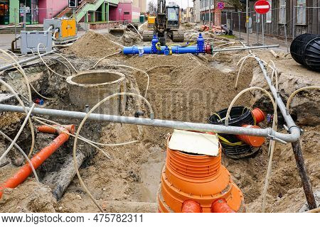 Underground Pipe Replacement Pit On City Street, Site Dewatering System, New Pipeline With Gate Valv