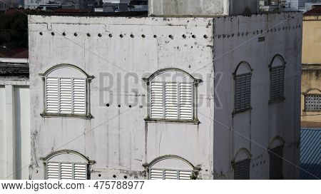 White Terraced Residential Buildings Where The Upper Floor Is Used As A Place For Cultivating Swallo