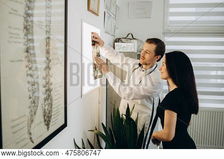Female Patient Examining Spine At Physiotherapist At Vertebrology Center