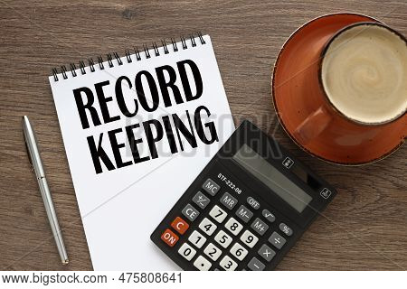 Record Keeping Notepad With Text Near Calculator. Business Concept. Education Concept.