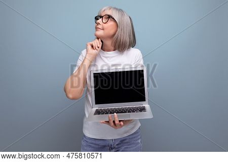Middle Age Business. Smart Mature Woman Pensioner Re-learn Remote Profession Using Laptop On Studio 
