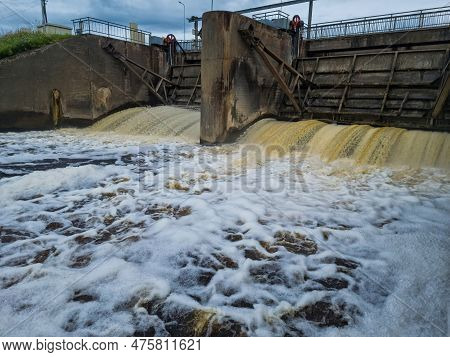 Dirty Brown Foamy Water In The River Nevezis City Panevezys Of Lithuania City Dam