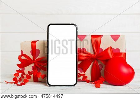 Mobile Phone With Blank Screen On Colored Background With Hearts, Calendar And Gift Box, Valentine D