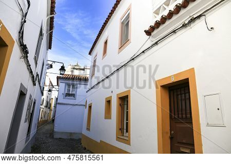 Evora, Portugal- October 10, 2022:typical Portuguese Facades And Cobblestone Streets In Evora Town, 