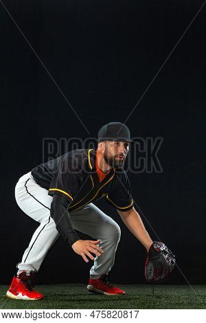 Baseball Player On Dark Background. Ballplayer Portrait.