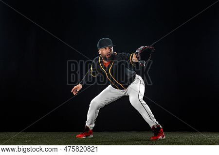 Baseball Player On Dark Background. Ballplayer Portrait.