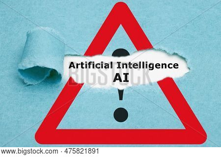 Text Artificial Intelligence Ai Appearing Behind Ripped Blue Paper On Attention Sign. Concept About 