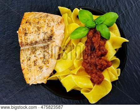 Italian Pappadelle Pasta With A Roasted Salmon Steak And Vegetables