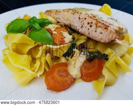 Italian Pappadelle Pasta With A Roasted Salmon Steak And Vegetables