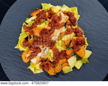 Italian Pappadelle Pasta With A Roasted Salmon Steak And Vegetables