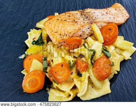 Italian Pappadelle Pasta With A Roasted Salmon Steak And Vegetables