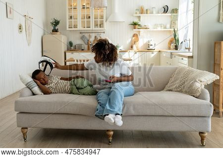 Tired Small Child Fell Asleep In Vr Glasses At Home, African American Mother Taking Off Virtual Real