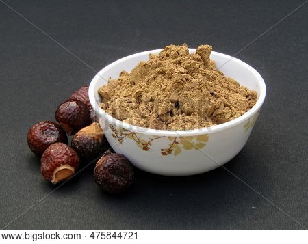 Indian Soapberry Or Sapindus Mukorossi Powder In A Bowl On Black Background