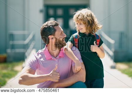 School Boy Going To School With Father. Happy Face. Thumbs Up Sign.