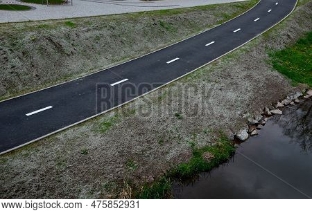 Stabilization Of Slopes By Hydro Sowing. A Mixture Of Wood Pulp And Green Grass Seed Is Sprayed From