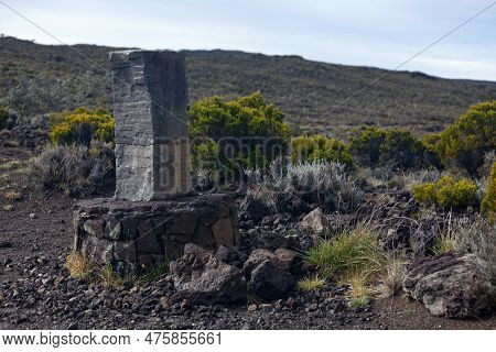 Stone Marker At The Cratère Commerson, In Les Hauts Of Reunion Island, On The Edge Of The Valley Of