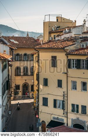 29 September 2021, Florencia, Italy: Top View Of A Beautiful Orange Colored Old Tenement House With 