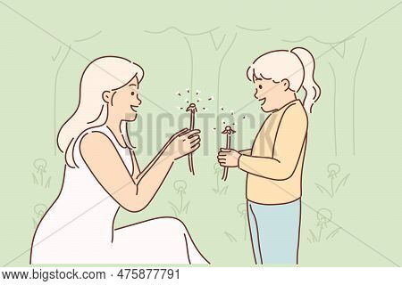 Mom And Little Daughter Are Holding Dandelions, Rejoicing At Onset Of Spring And Good Hot Weather. C