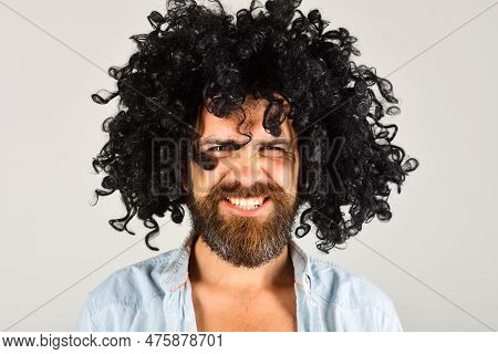 Bearded Man In Black Wig. Angry Man With Beard And Mustache In Curly Wig. Bearded Hipster In Black C