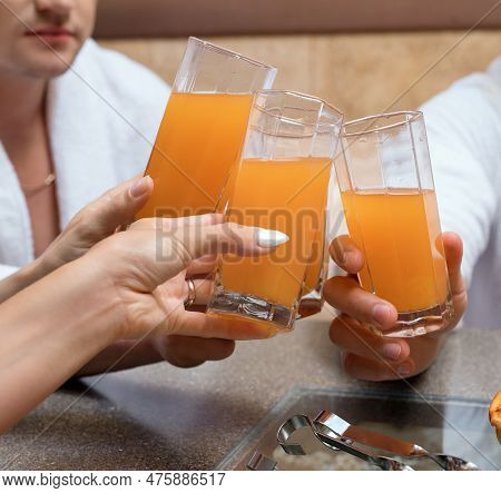 Fruit Juice Glasses On Foregound Croppped View