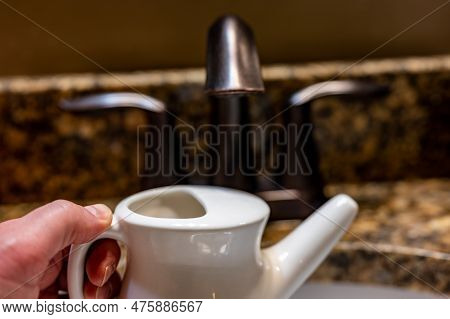 Improperly Filling A Neti Pot With Nonsterile Tap Water.