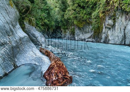 Huge Pice Of Driftwood Stuck Against The Cliff At The Opening To The Callery Gorge In The West Coast