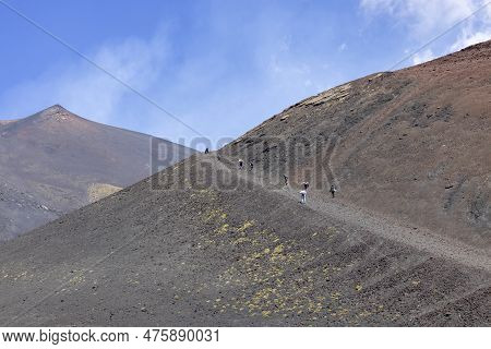 Mount Etna, Sicily, Italy - April 27, 2023: People Walking Path On Crater Silvestri On The Slope Of 