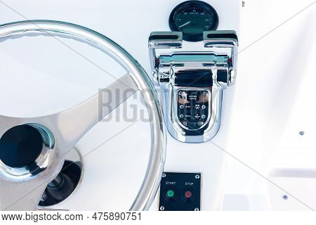 Motor Yacht Control Panel. Steering Wheel, Gear Levers, Control Button Tachometer. Luxury Yacht Navi