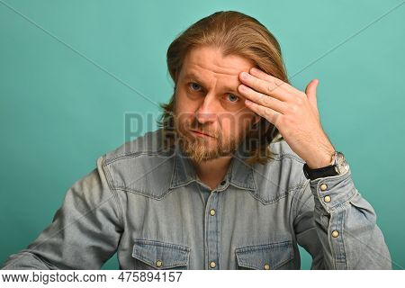 Man In Front Of Mirrror Looking At His Wrinkles