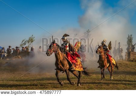 Gniew, Poland, Aug 2020 Winged Hussars, Polish Heavy Cavalry Fight On A Battlefield. Historical Reen
