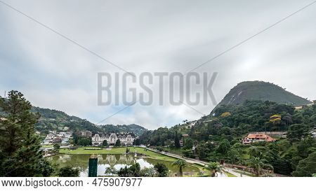 Sunrise Over Quitandinha Palace Surrounded By Mountains And Clouds