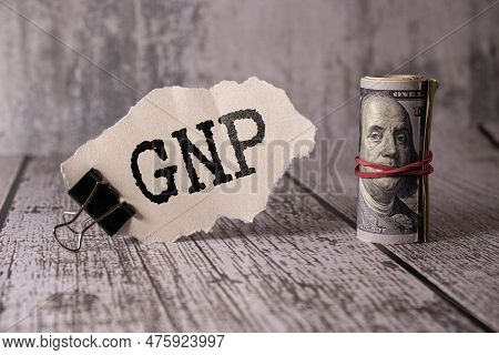 Small Black Chalk Board In A Pot With Succulents Inscribed In White Letters Word Gnp Gross National 