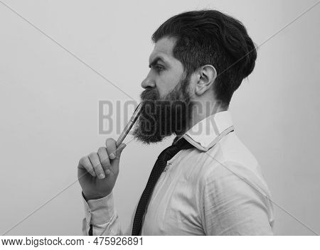 Thinking Man. Portrait Of A Teacher Or Professor At Classroom. Satisfied Serious Mature Teacher. Mat