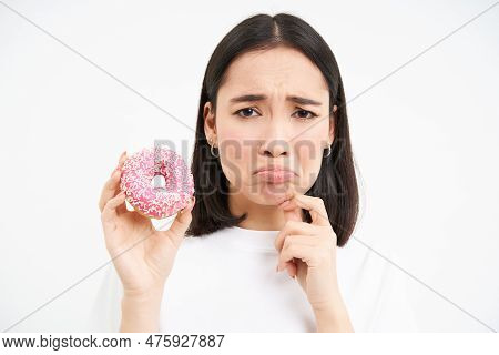 Close Up Of Sad Cute Girl, Shows Tasty Glazed Doughnut, Being On Diet, Cant Try Delicious Donnut, Ju