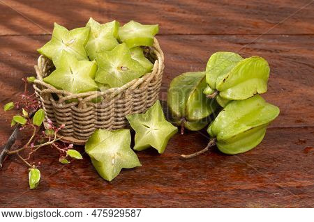 Star Fruit Or Carambola Green - Averrhoa Carambola; Photo On Wooden Background