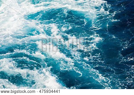Turbulent Streams Of Blue River Water, With Splashes And Foam.